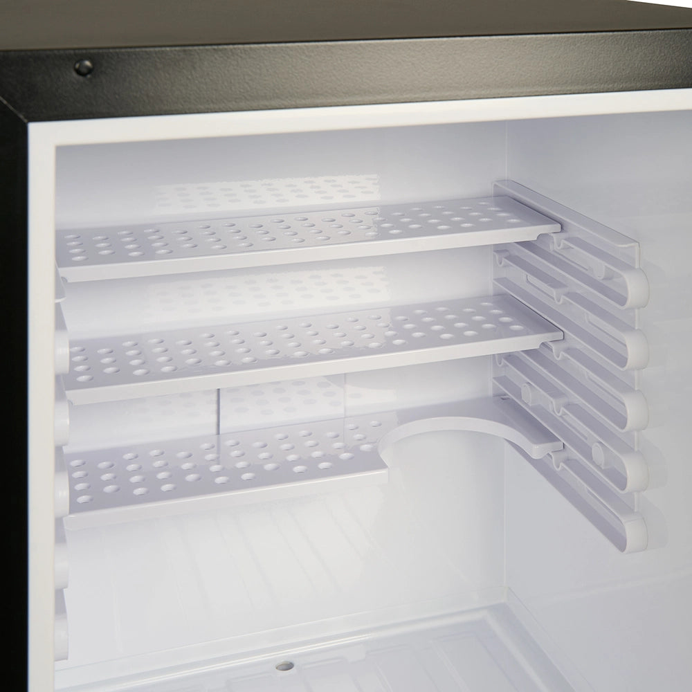 Empty refrigerator shelves inside a freezer