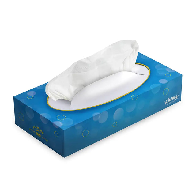 Blue tissue box with white tissues on a white background