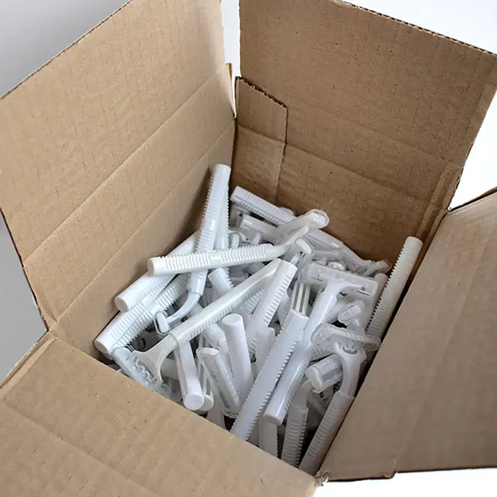 Cardboard box filled with 50 white plastic Disposable Razors