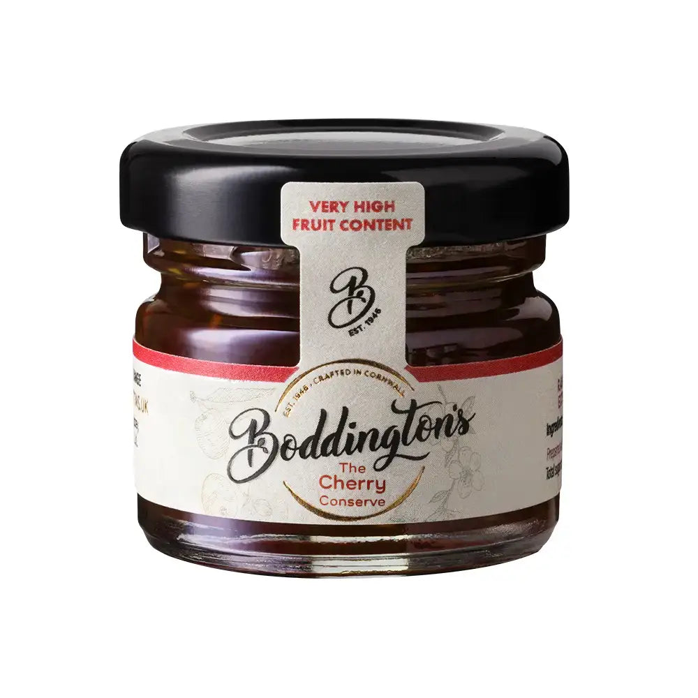 Jar of Boddington's Cherry Conserve with a black lid on a white background