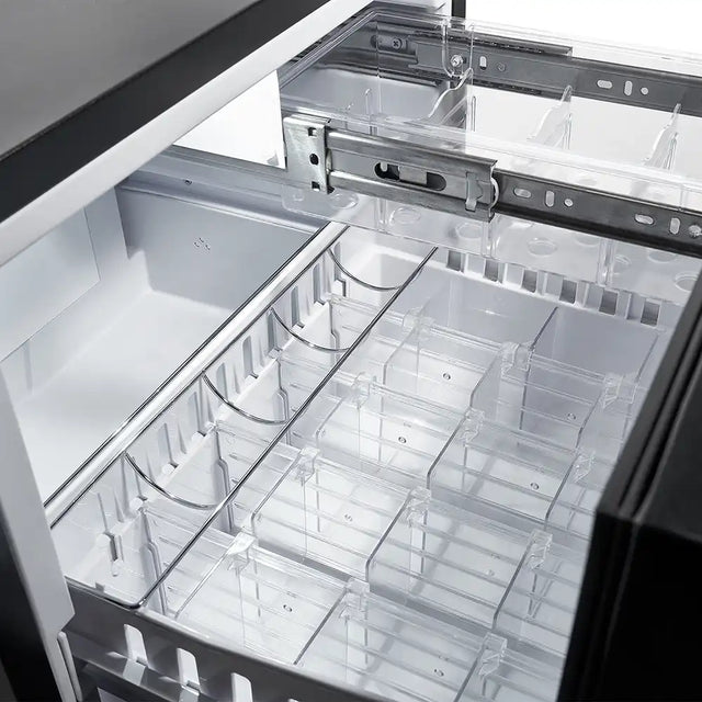 Close-up of a clear plastic drawer organiser inside a minibar.