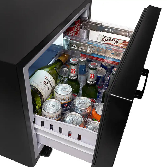 Open refrigerator door filled with various bottles and cans of alcohol.