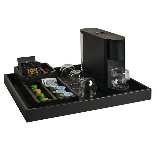 Black with coffee machine, glasses, and coffee pods on a white background