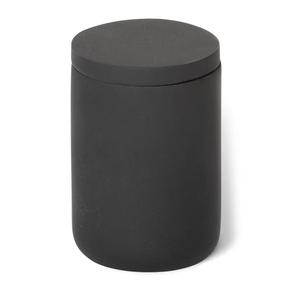Black cylindrical amenity jar with a lid on a white background