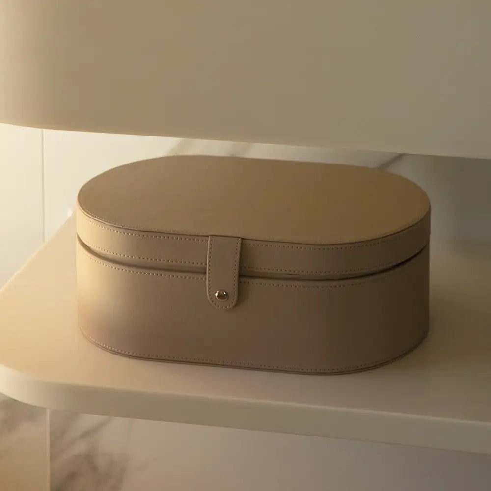 Beige storage box on a white surface with a soft light background