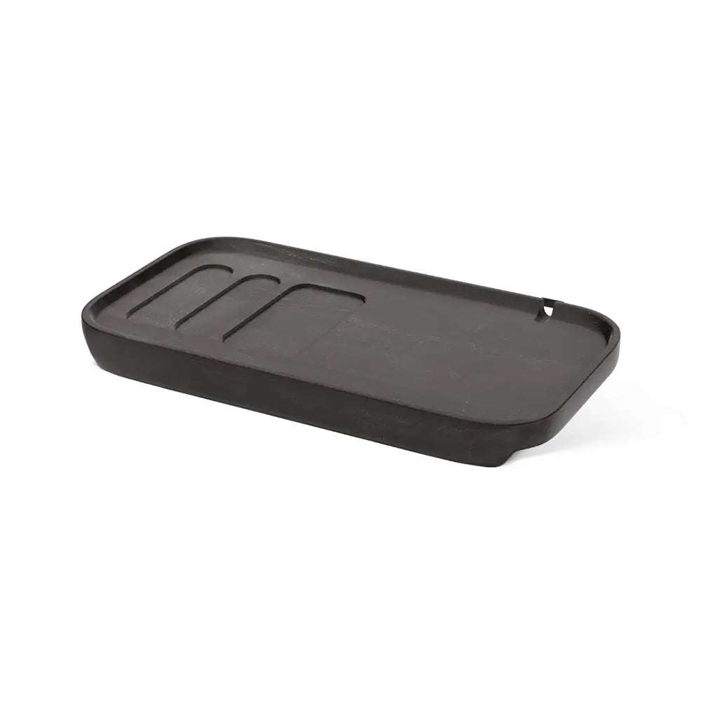 Black tray with grooves on a white background