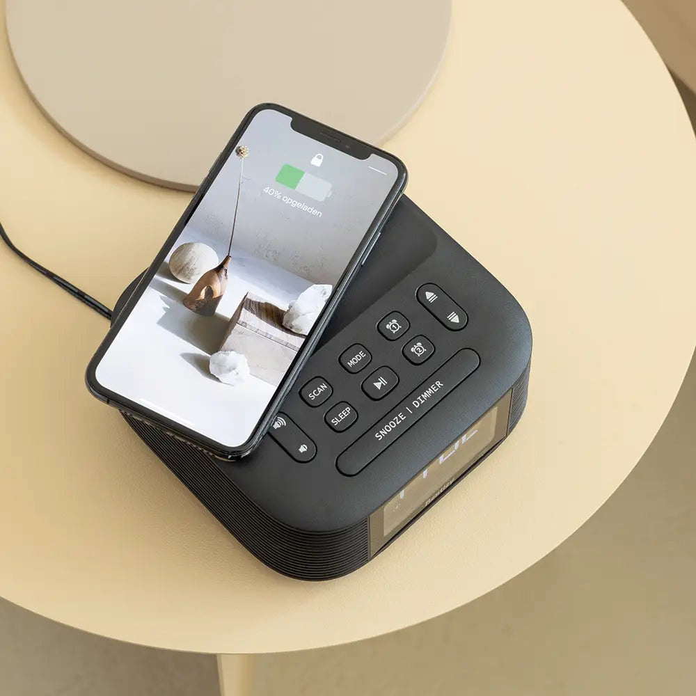 Black digital clock with wireless charging pad
