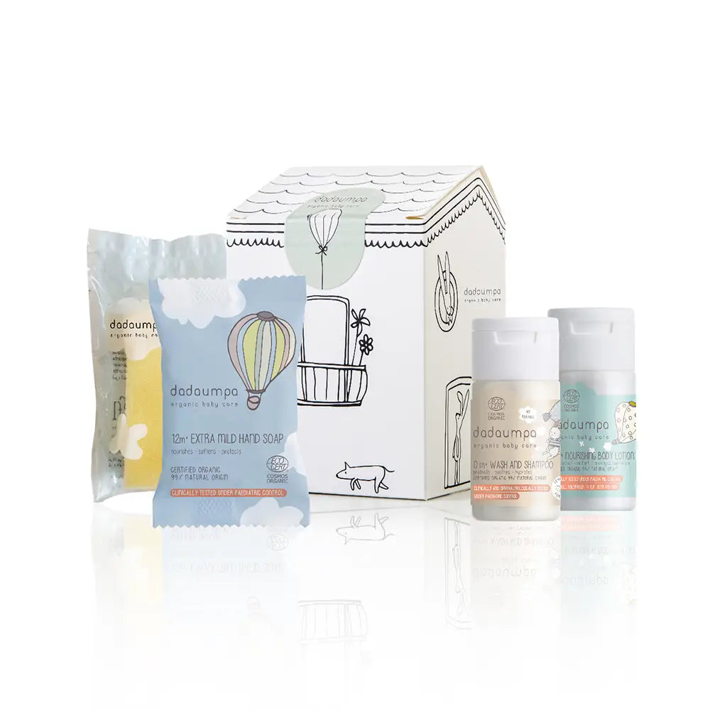 Dadaumpa baby care toiletries including a box, soap packets, and bottles on a white background