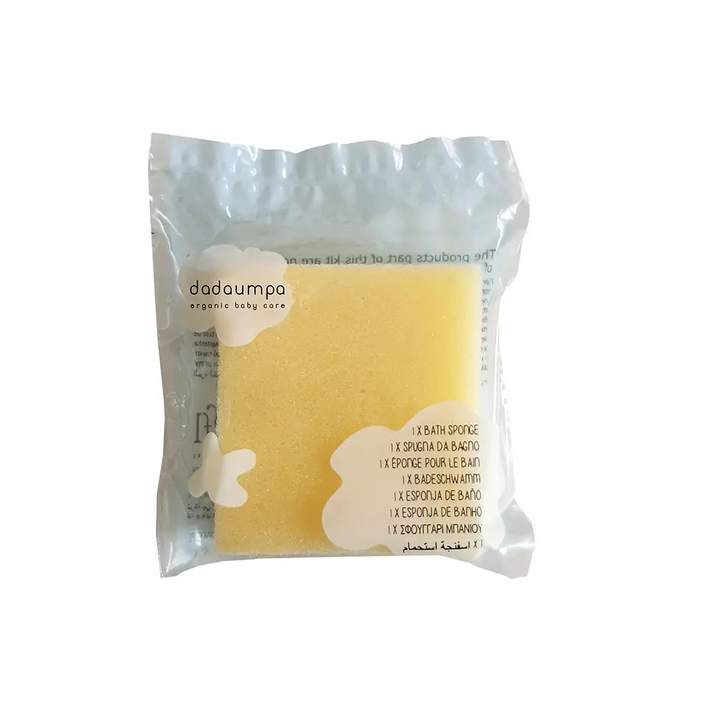 Dadaumpa yellow bath sponge in a clear package on a white background