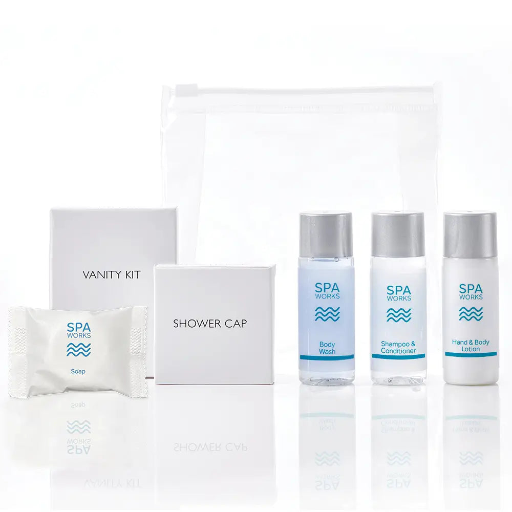 Spa Works welcome pack with body wash, shampoo & conditioner and hand & body lotion, soap, shower cap and vanity kit on a white background