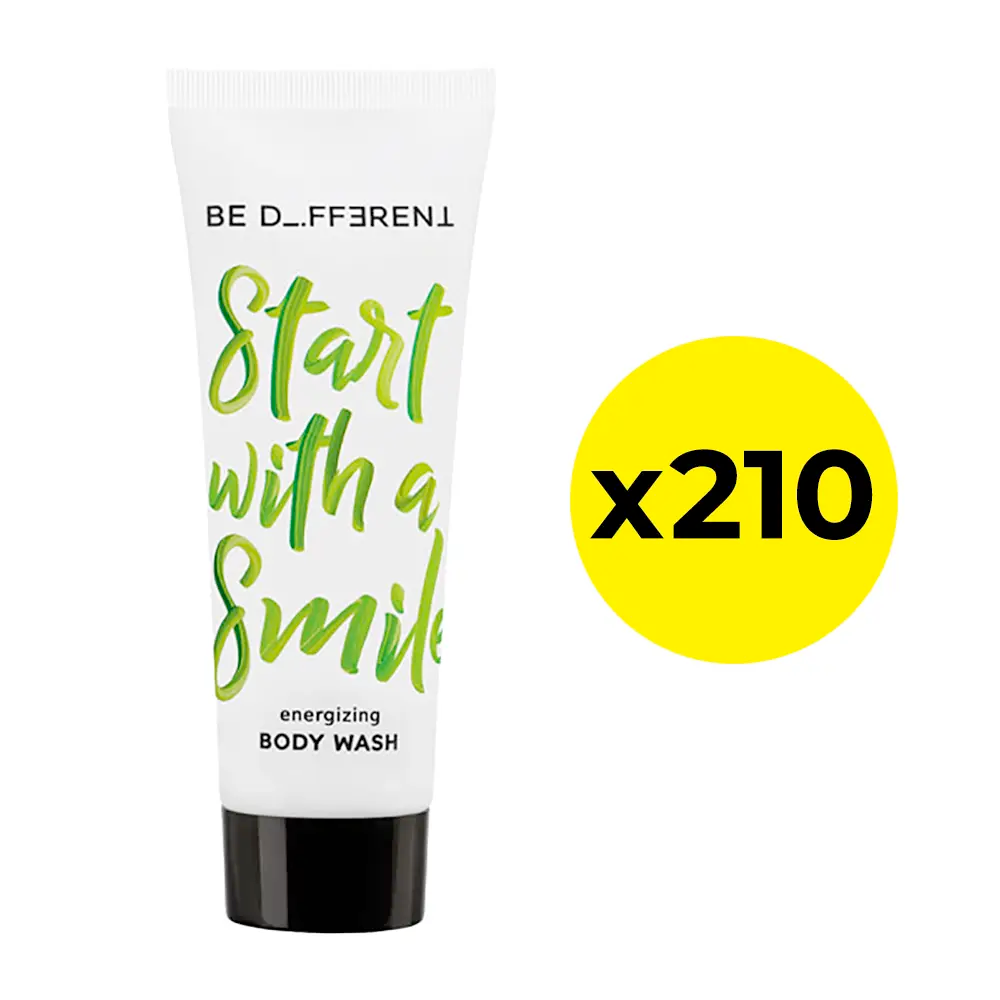 Body wash tube with green text and a yellow circle with 'x210' on a white background
