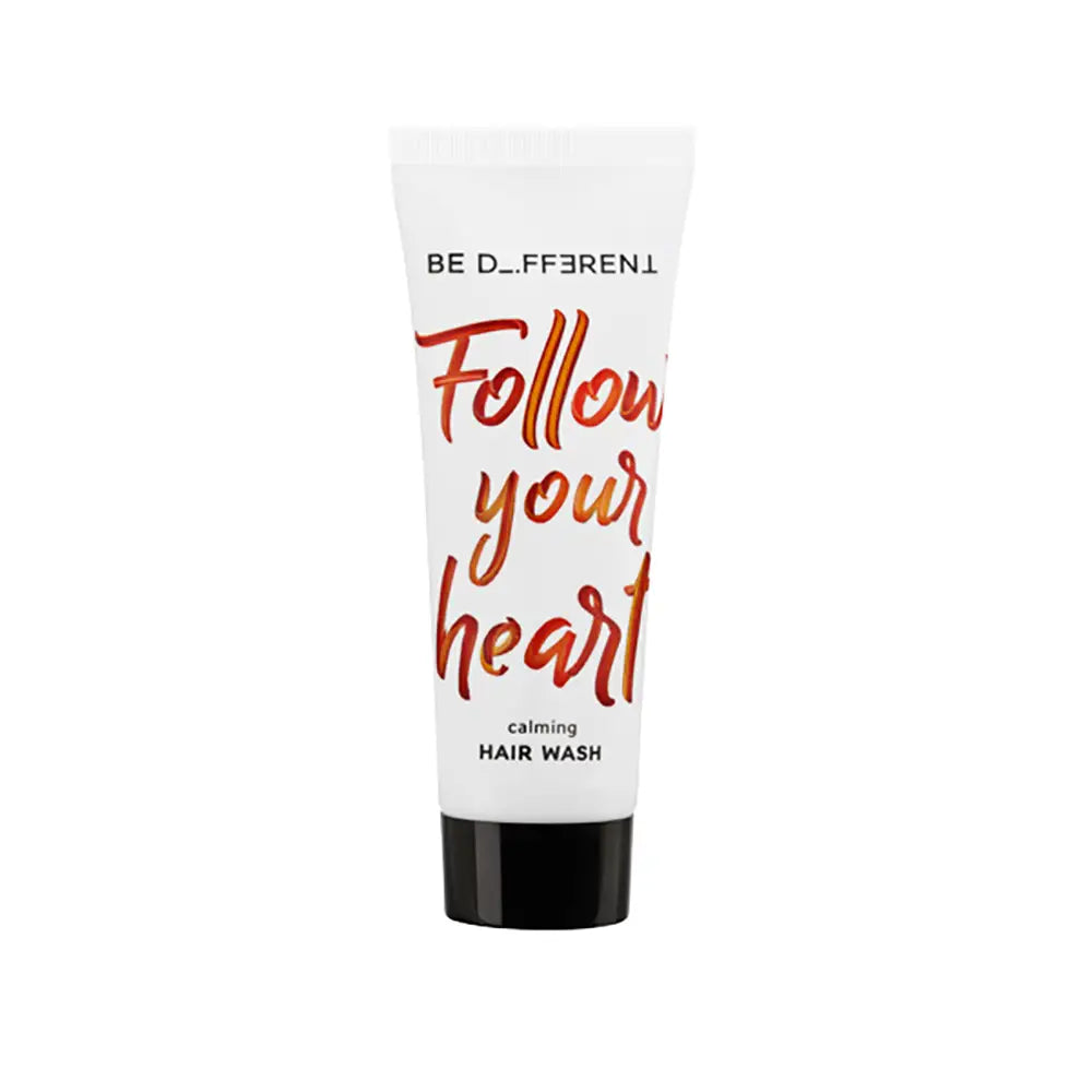Hair wash tube with 'Follow your heart' text on a white background