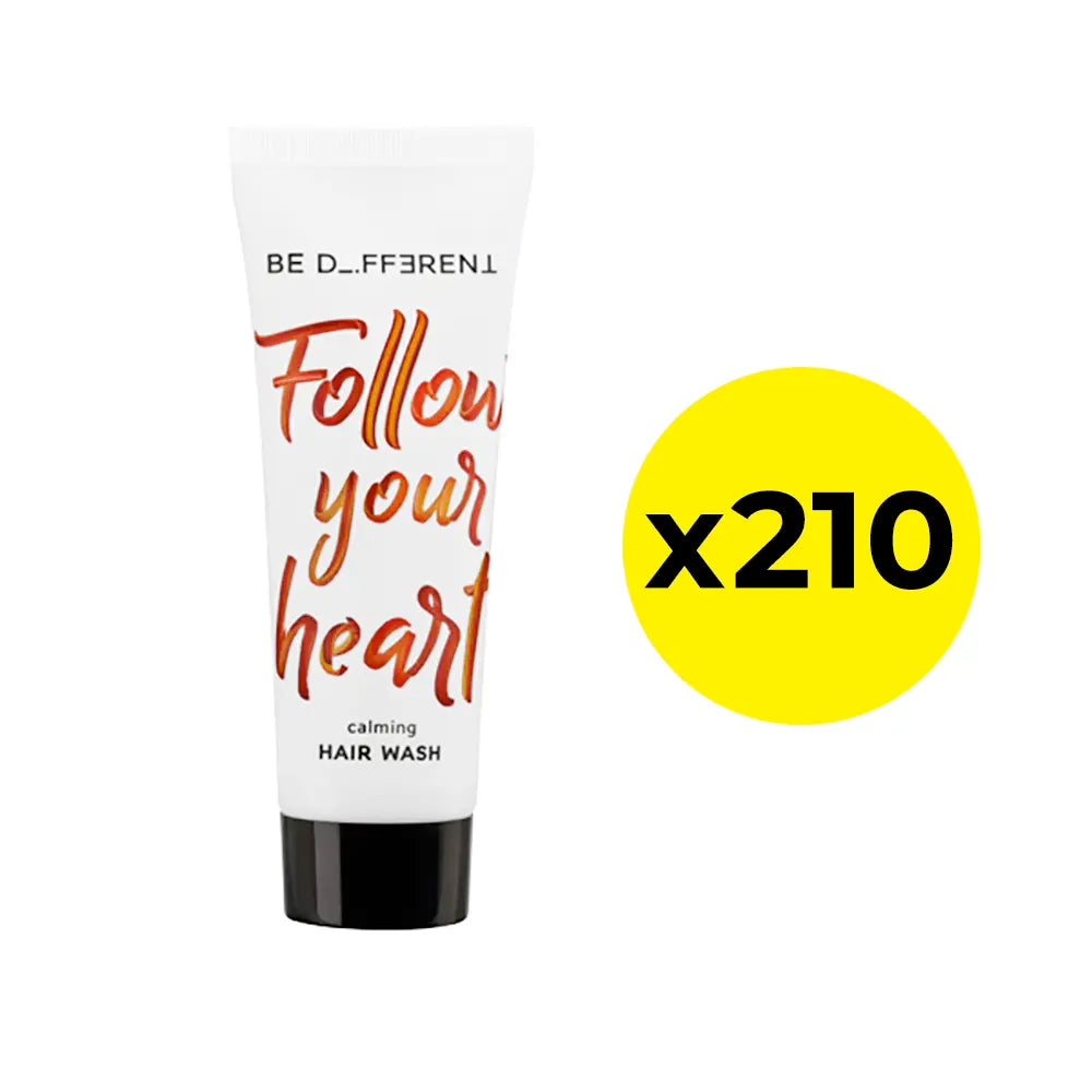 Hair wash tube with 'Follow your heart' text on a white background