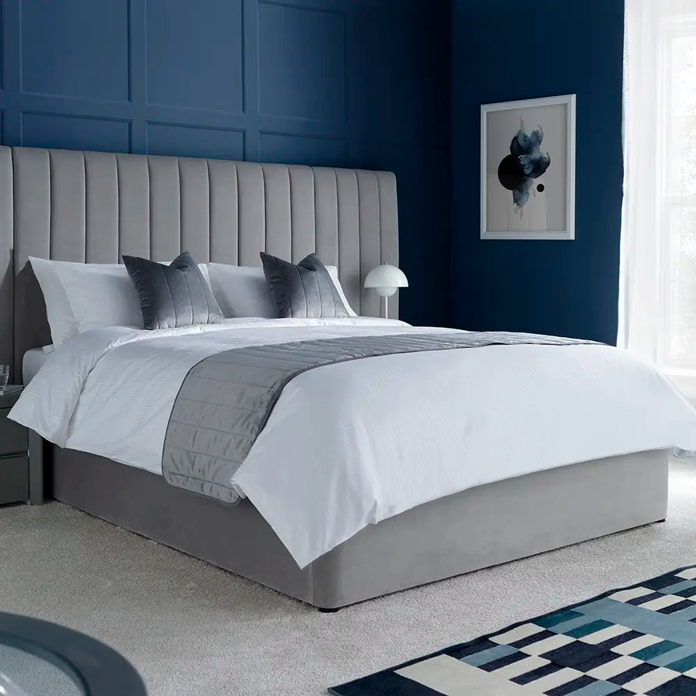 Gray upholstered bed with Luxury Cotton Micro Stripe 300 Thread Count Duvet Cover in a bedroom with blue walls.