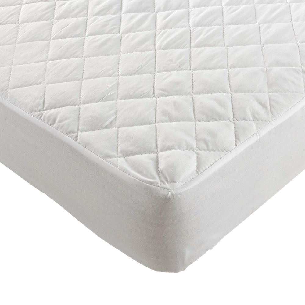 Close up of quilted mattress protector showing detailed stitching and corner fitting