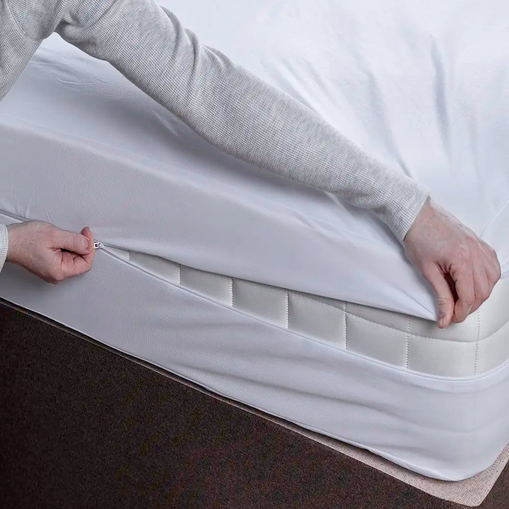 waterproof and fully-sealed mattress encasement being zipped up
