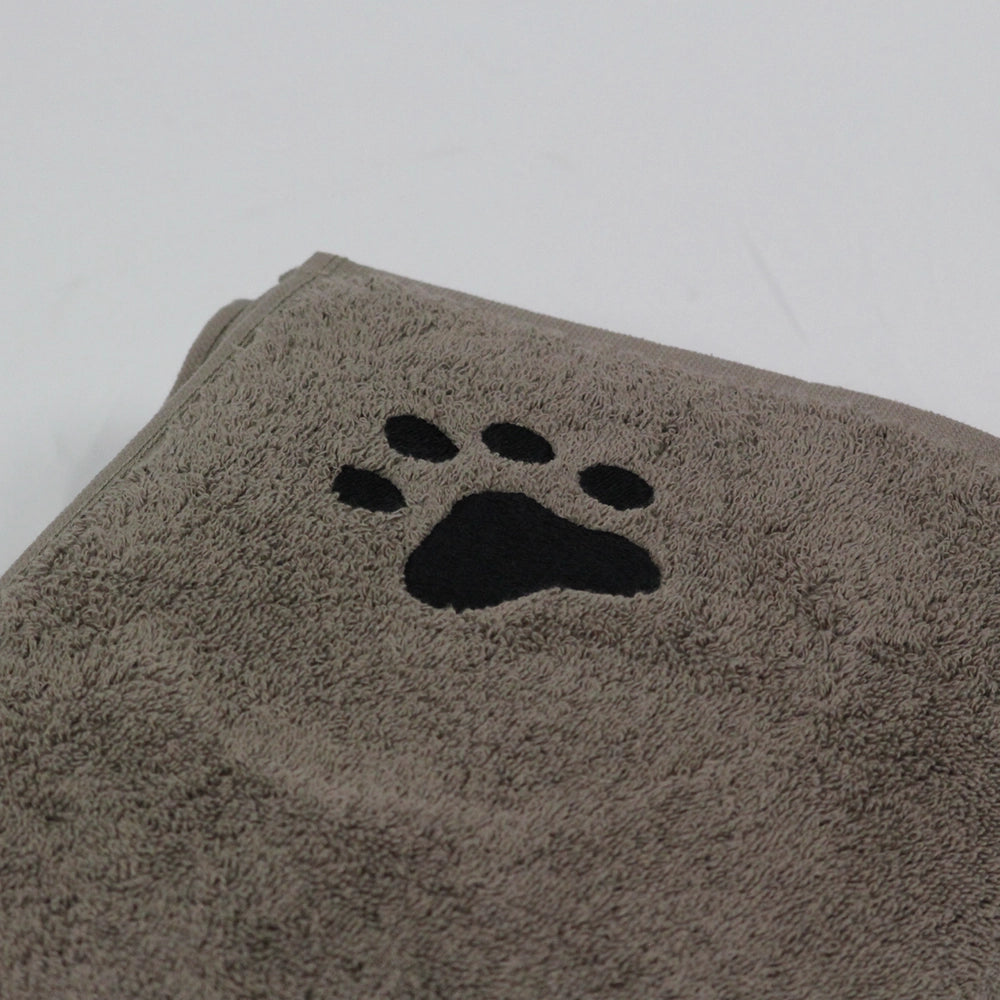 Dog towel showing close up of embroidered dog paw in black