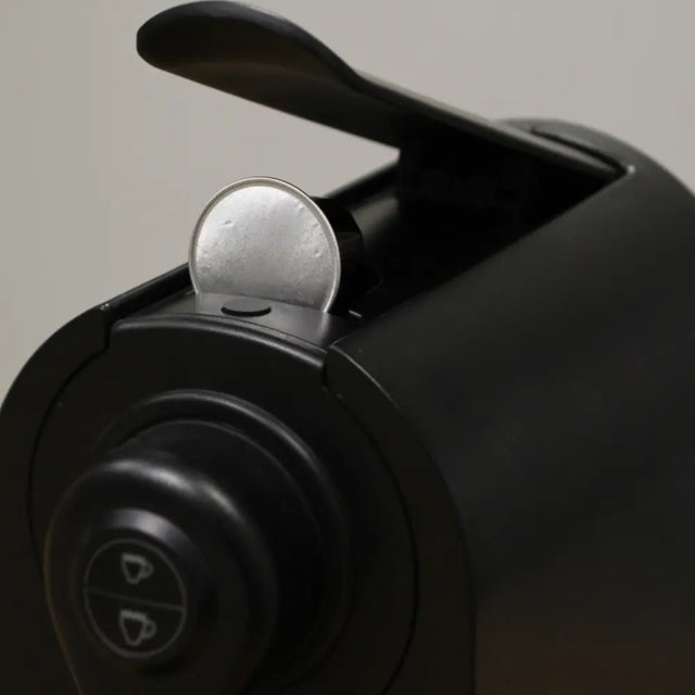 Close up of coffee pod in use in machine