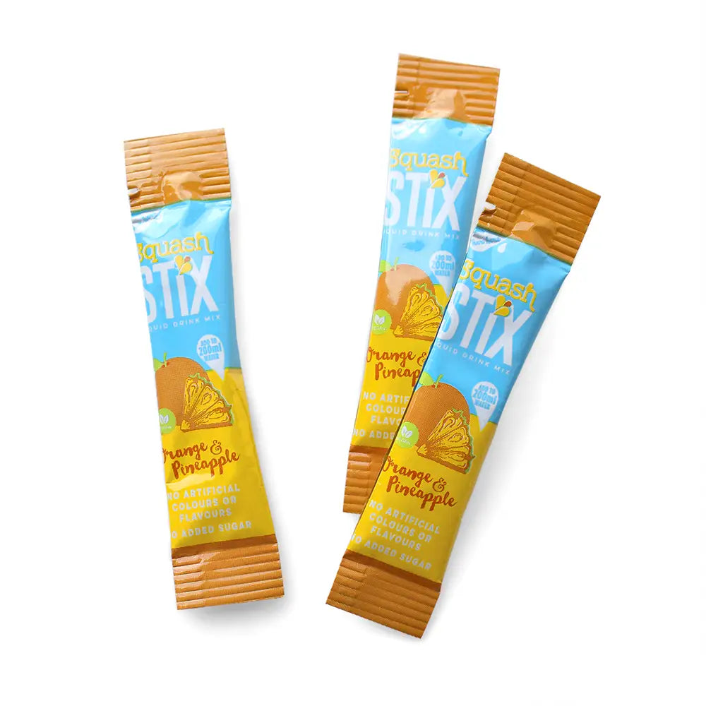 Three packages of Orange & Pineapple Stix flavor on a white background