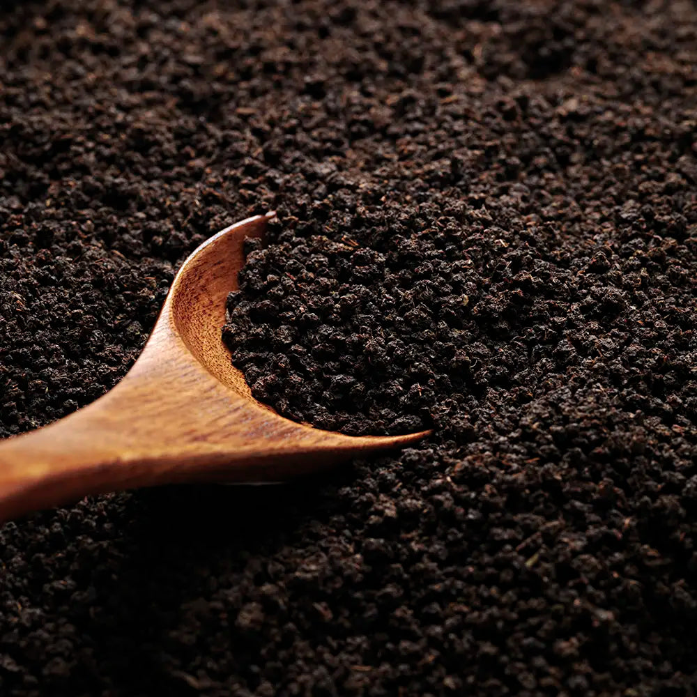 A close up of the loose black tea leaves found inside each prism tea bag of Birchall Great Rift Breakfast Tea.