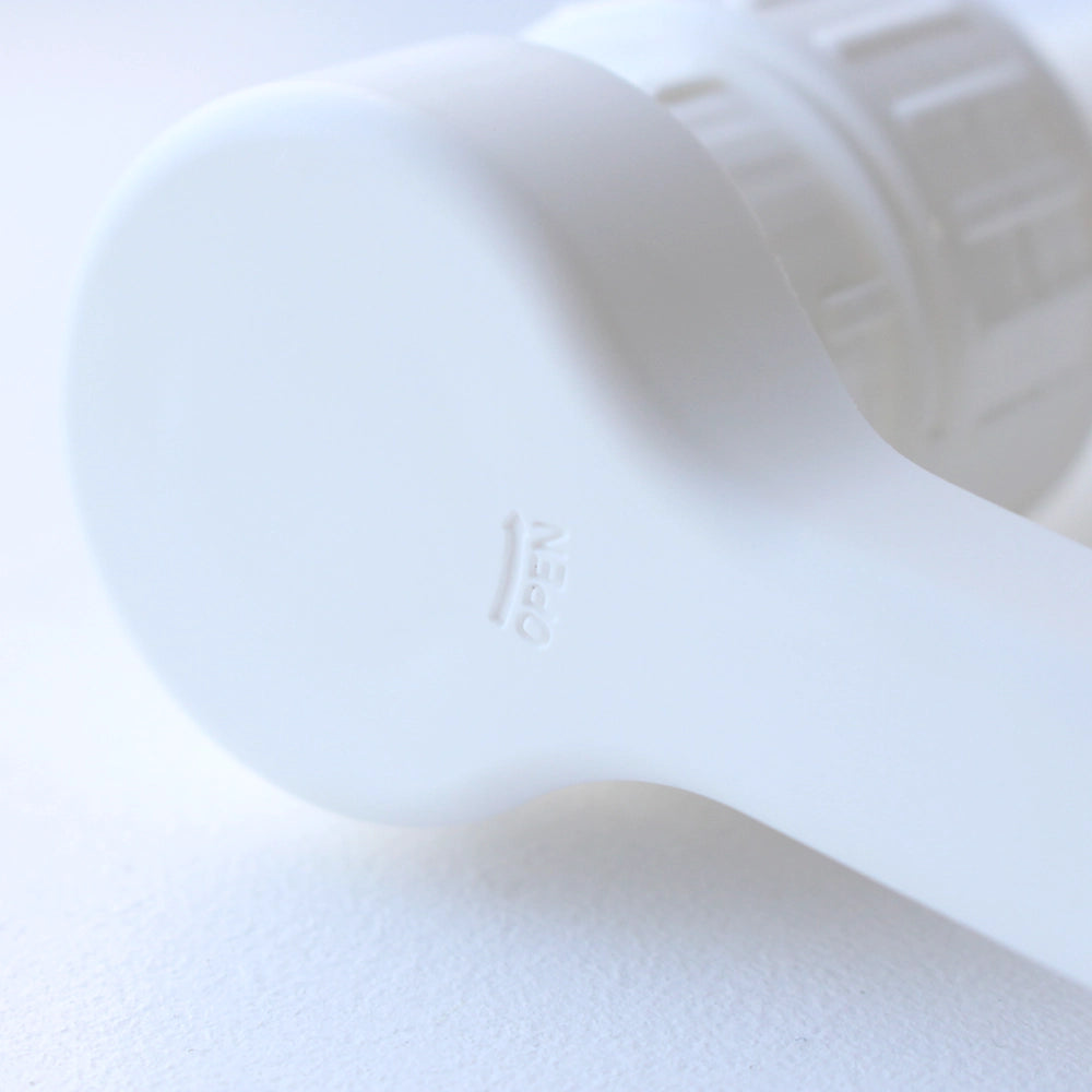 Close up of top of pump dispenser showing open position