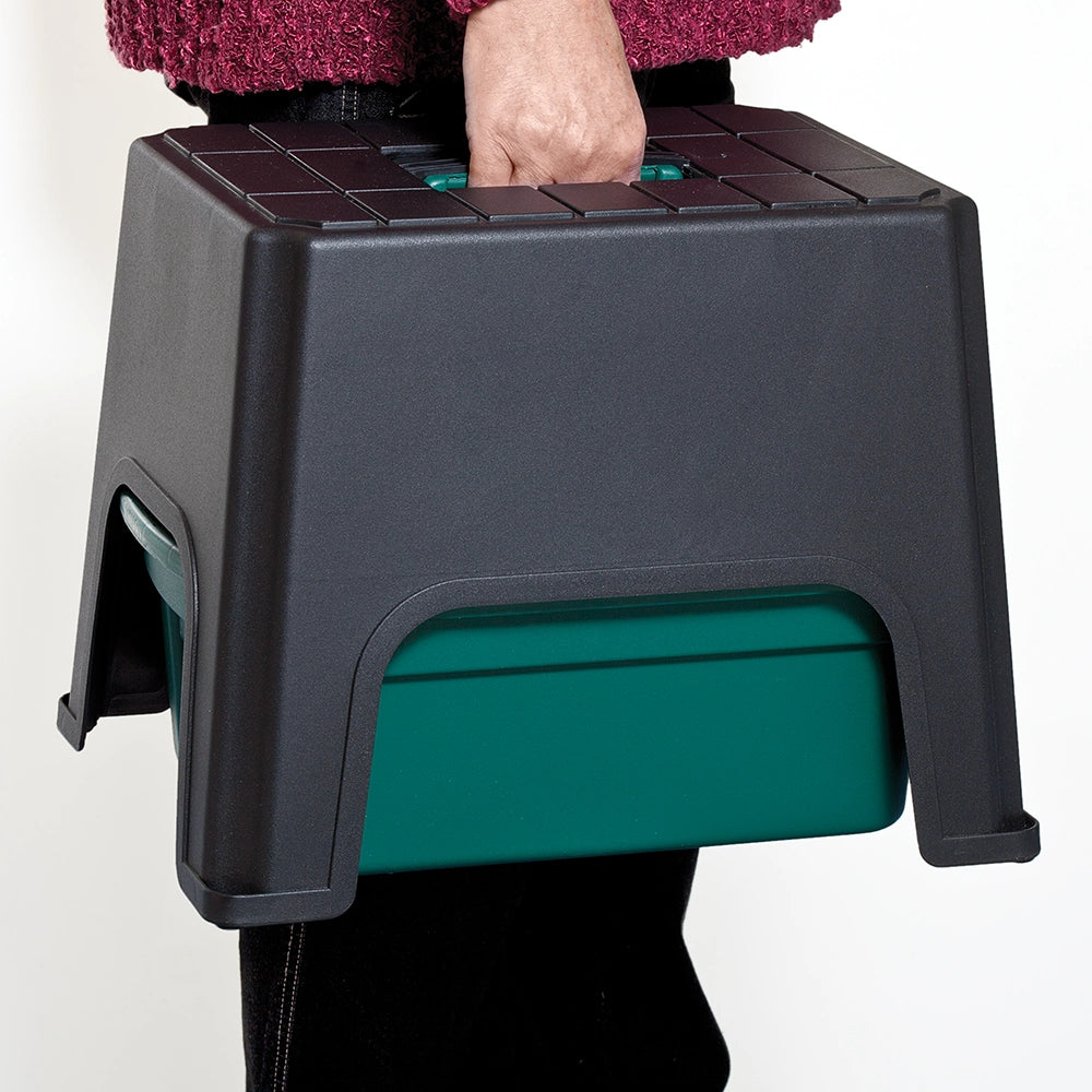 Green plastic caddy combined with black stool as a carry and storage solution