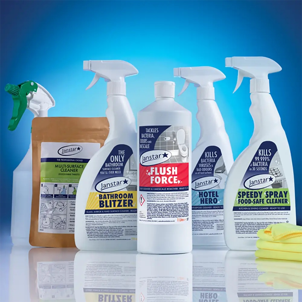 Collection of Janstar cleaning products on a reflective surface with a blue gradient background