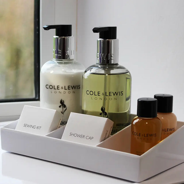 Small white Melamine Display Tray with including Cole & Lewis London toiletries, shower cap and sewing kit