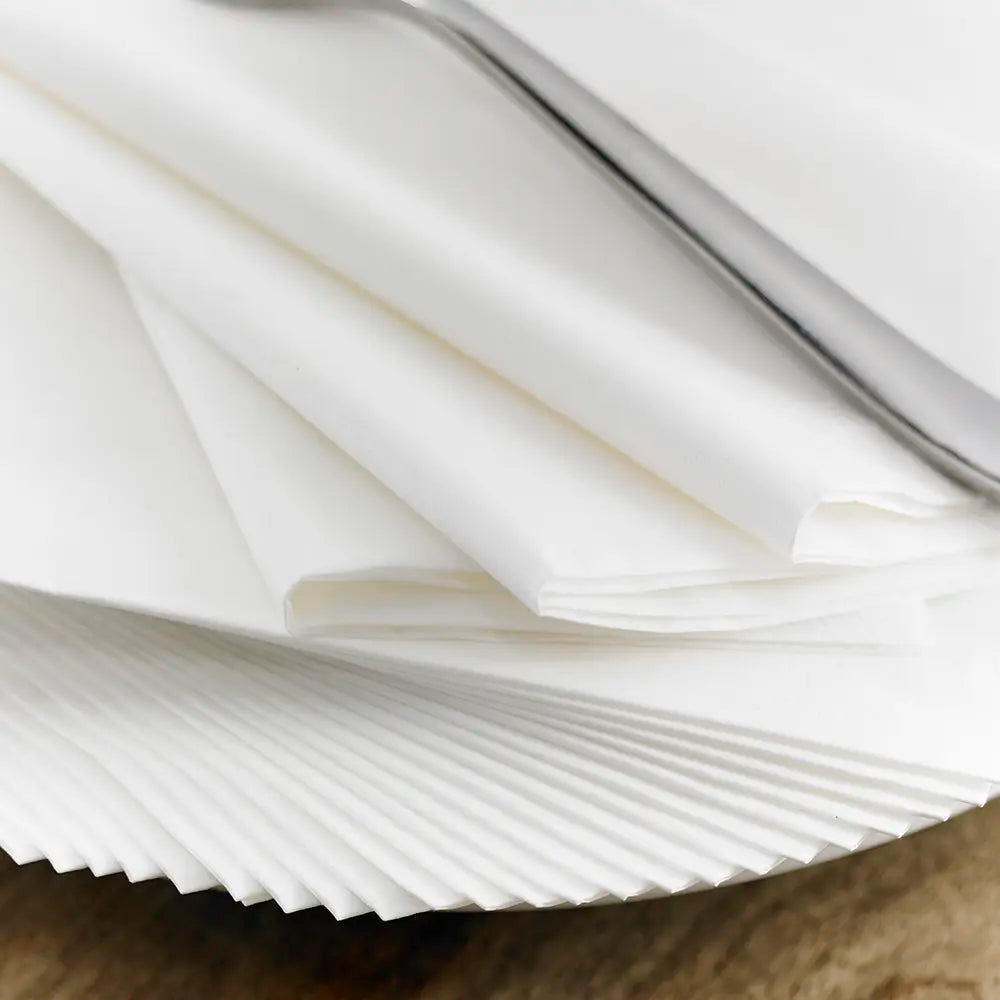 Neat pile of 2 ply paper napkins in a lifestyle setting