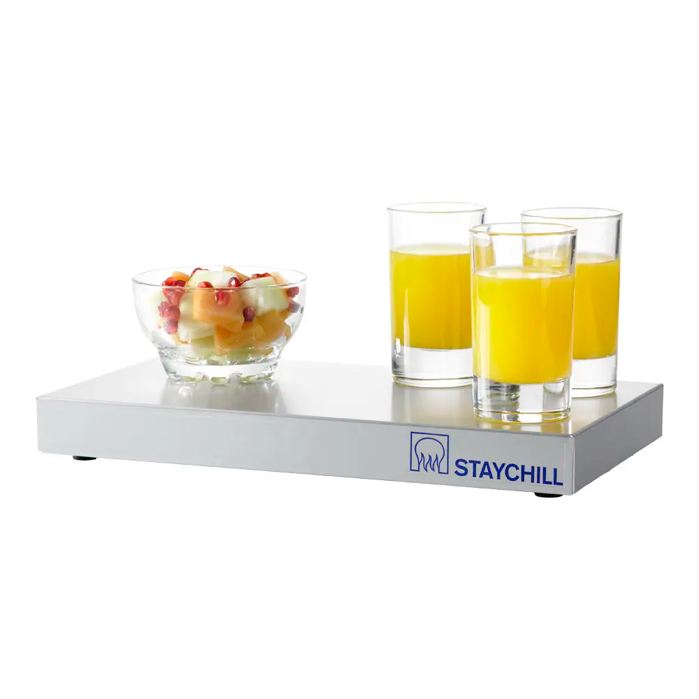 Staychill tray with glasses of juice and a bowl of fruit on a white background