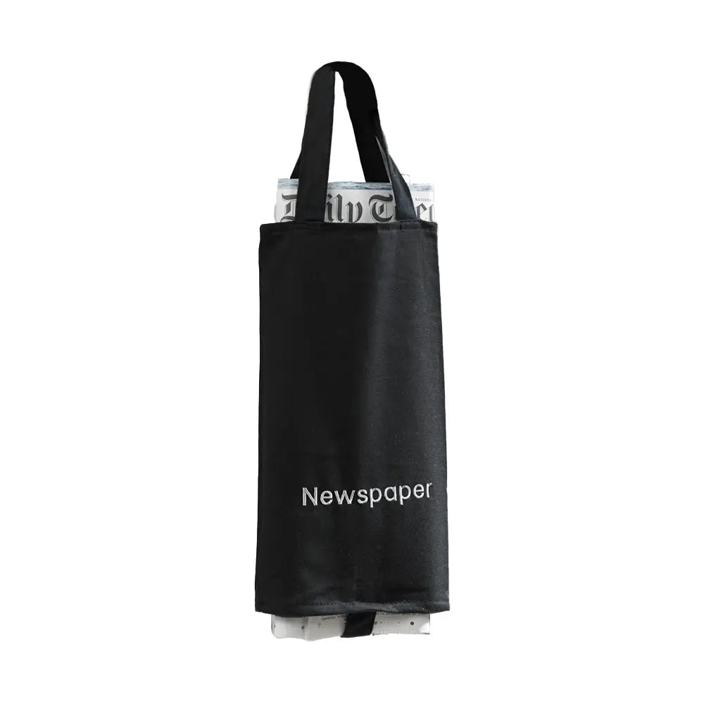 Black newspaper holder with 'Newspaper' embroidered on to the bag