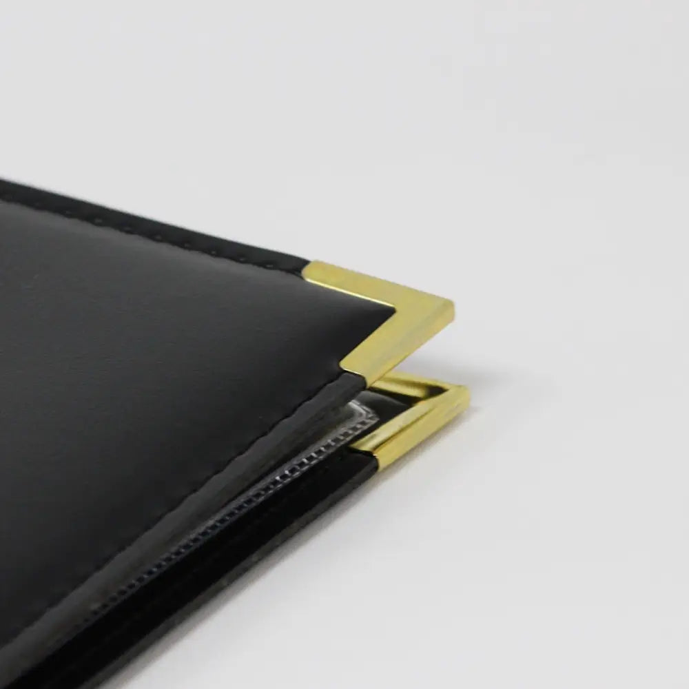Faux black leather guest information folder with 'Welcome' in gold and gold corners