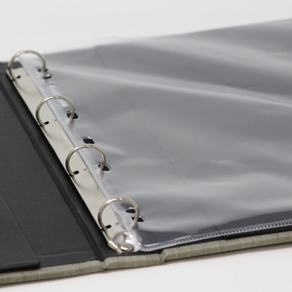 Open black ring binder with PVC display folders inserted