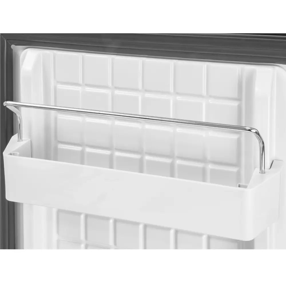 Close-up of a refrigerator white interior door.