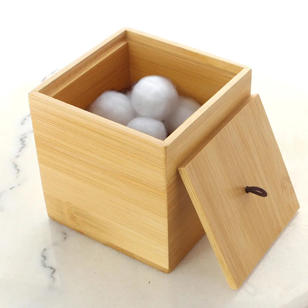Wooden Bamboo Cube Container displaying products that can be stored in item