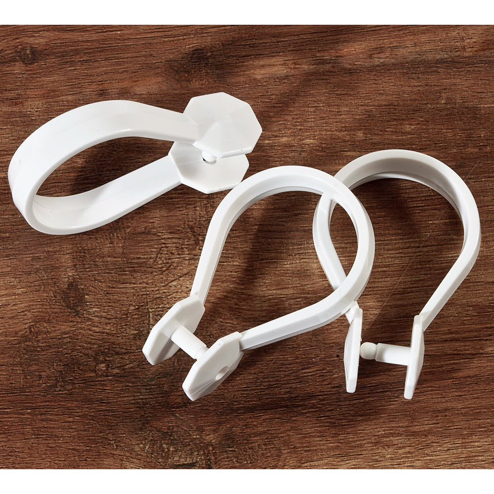 3 White plastic rings used for hanging a shower curtain