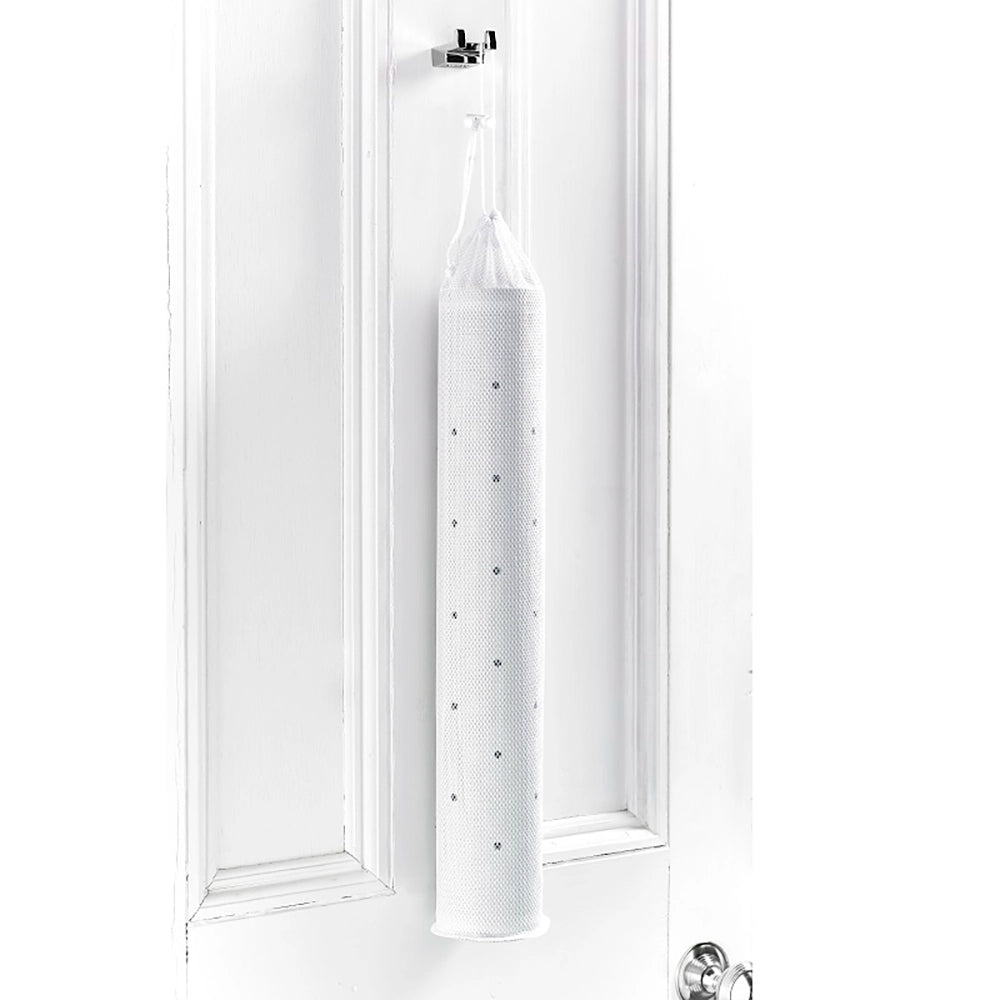 Mesh bag containing a rubber mat, hung on the back of a bathroom door