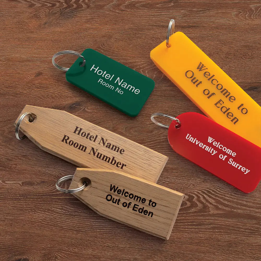 Four key tags on a wooden surface, each with different style text.