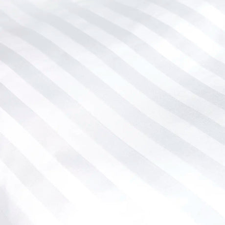 Close-up of white satin stripe bed linen fabric texture