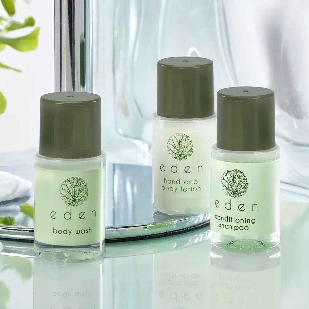 Eden hotel toiletries range on mirrored bathroom shelf – body wash, hand and body lotion, and conditioning shampoo