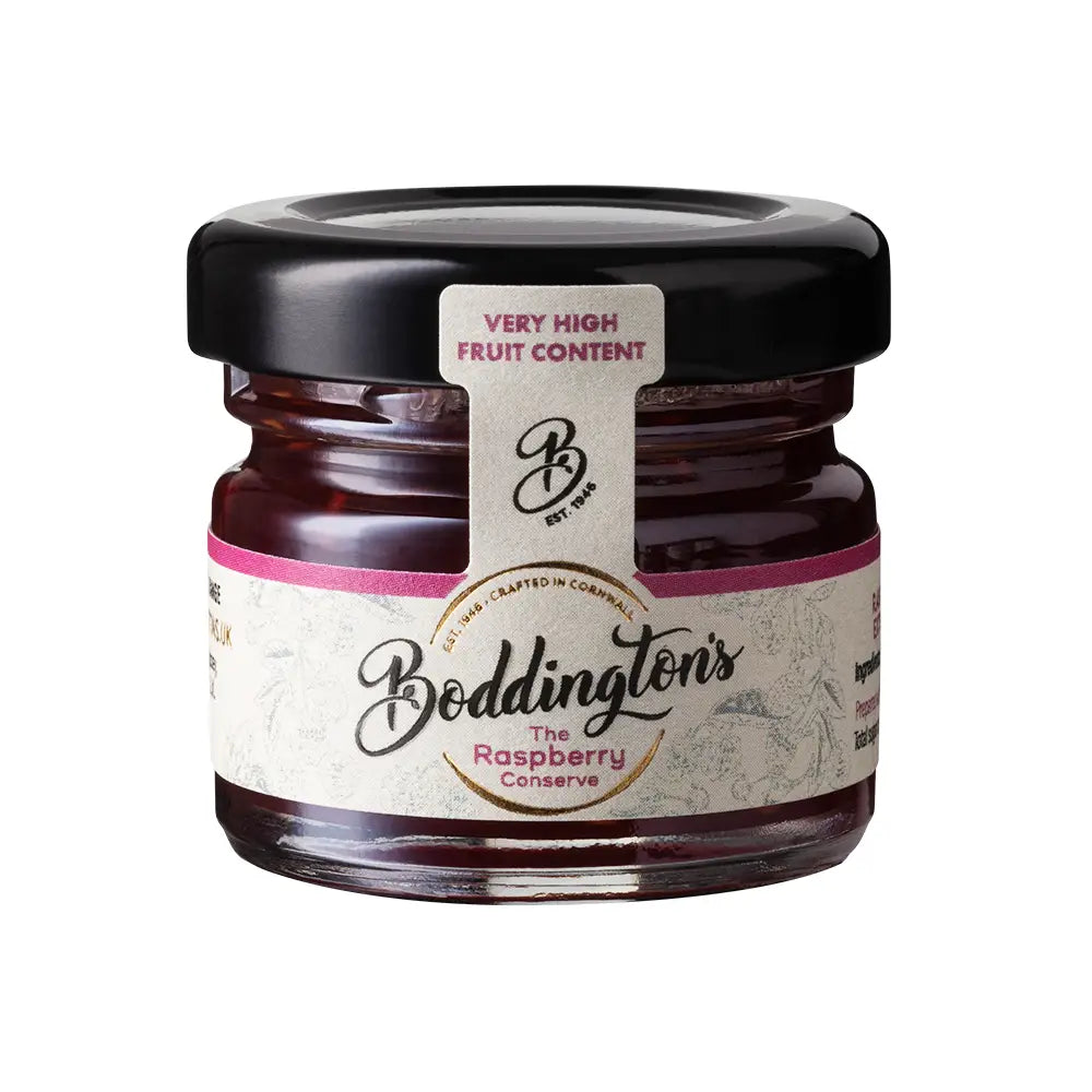 Jar of Boddington's Raspberry Conserve with a black lid on a white background