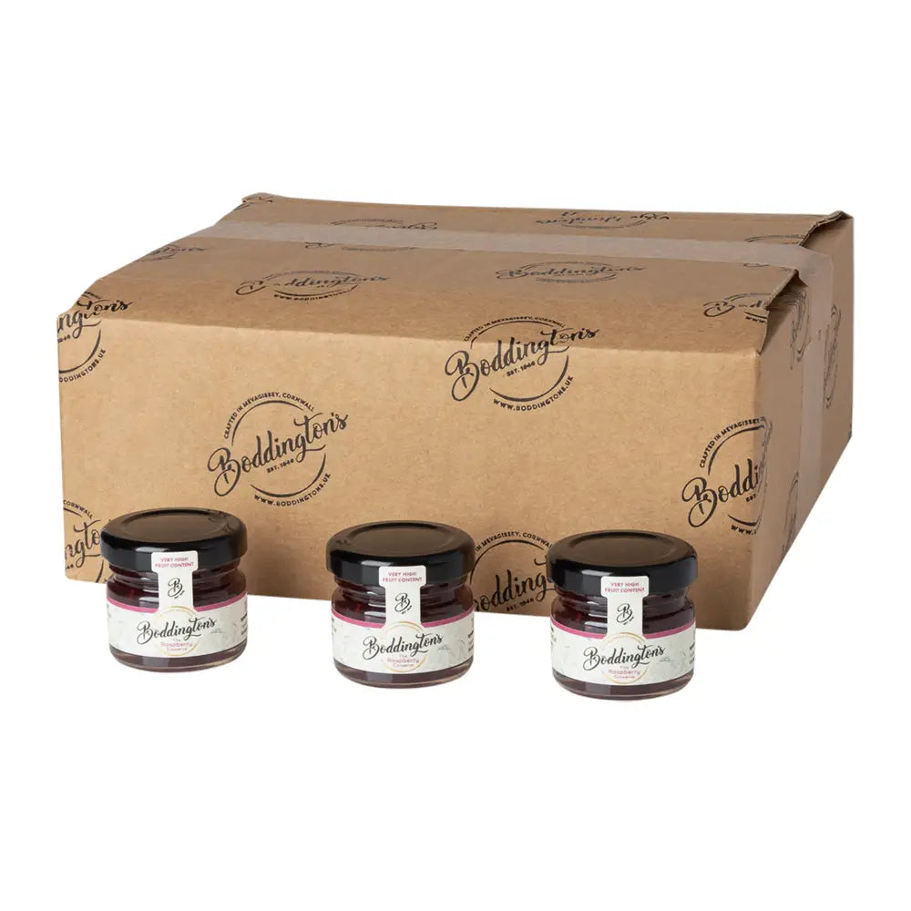 Three jars of Bedlington's jam in front of a large cardboard box with the brand logo.
