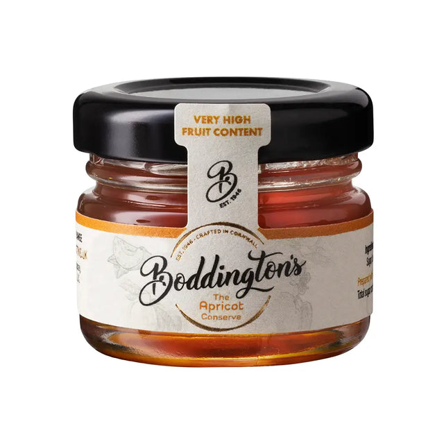 Jar of Boddington's Apricot Conserve with a black lid on a white background