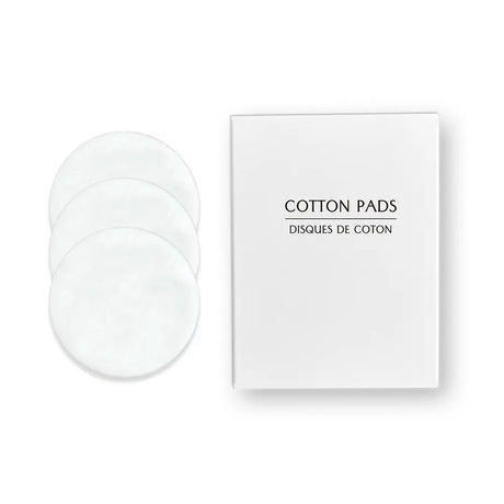 Three cotton pads with a white box labelled 'Cotton Pads' on a white background