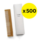 Wooden comb and white packaging with 'COMB' text on a white background