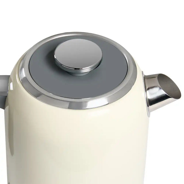 Close-up of a cream-coloured electric kettle with a silver lid and handle on a white background
