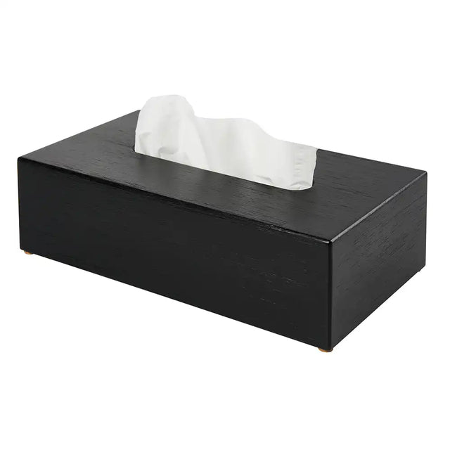 Black rectangular tissue box with tissues on a white background