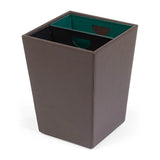 Brown leather wastebasket with green and black internal containers on a white background