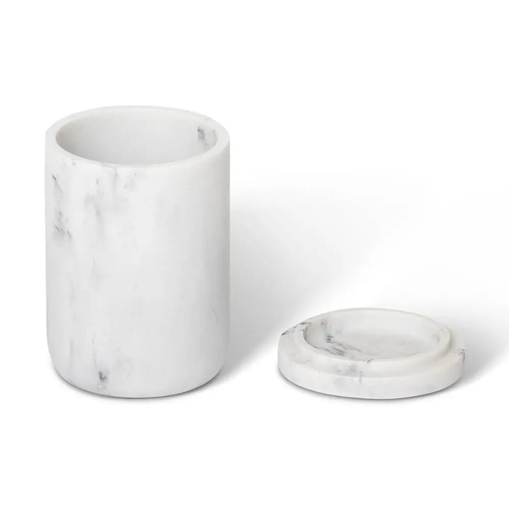 Marble-textured cylindrical amenity jar with lid on a white background