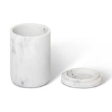 Marble-textured cylindrical amenity jar with lid on a white background